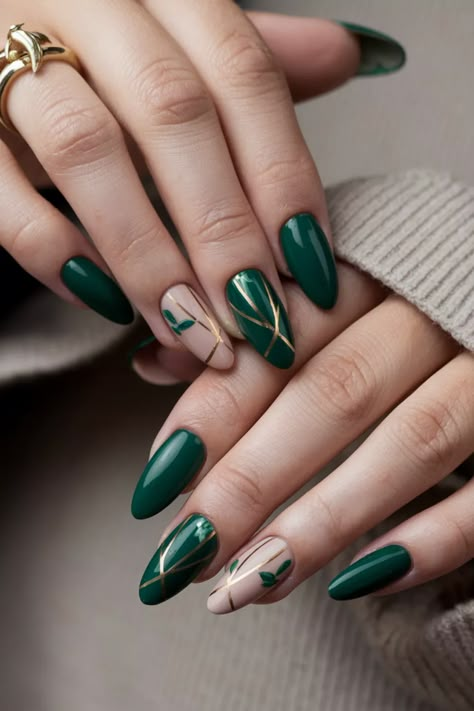 Embrace the essence of autumn with these cozy green nail ideas perfect for fall. Imagine a deep forest green base adorned with delicate gold leaf accents, capturing the beauty of fall foliage. This chic combination not only reflects the warm colors of the season but also adds a touch of elegance to your style. Transform your nails into a statement of seasonal charm and individuality with this gorgeous look. Autumn Nails 2024 Green, Autumn Nail Designs Green, Nail Green And Brown, Nail Green Gold, Colourful Autumn Nails, Mid November Nails, Green November Nails, November Nails Green, Green Forest Nails