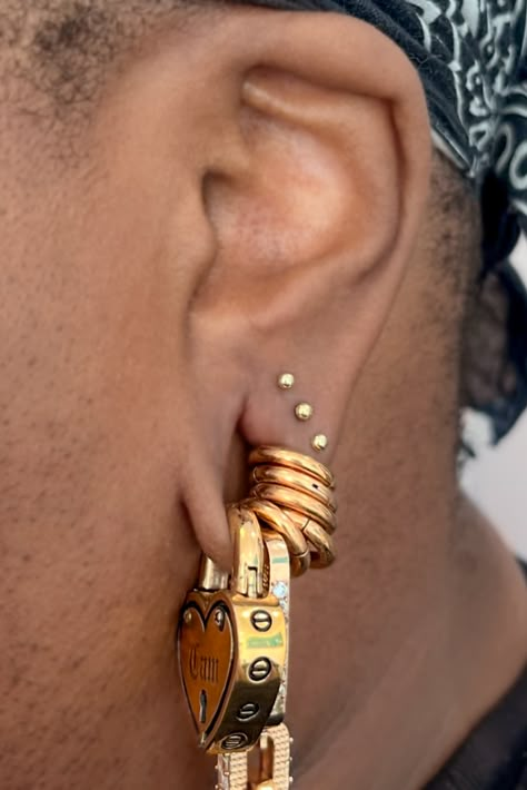 Triple lobe for Cam, featuring some stunning weights from @mayajewelry.   Done at @sogoldbk"  — @cassisoclassy (all on IG)  Cam wears custom engraved Forever Yours weights and Chain Reaction all in Yellow Gold.  Shop Ear Weights in the Link Below: Stretched Ear Curation, Ear Weights Stretched, Aries Constellation Piercing, Stretchers Ear Piercings, Double Snug Piercing, Small Stretched Ears Aesthetic, 0 Gauge Ears, Ear Gauges Aesthetic, Small Stretched Ears