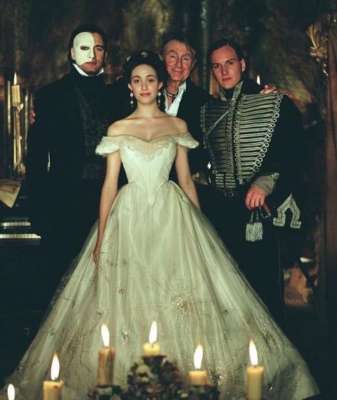 Iconic Beauties🍒 on Instagram: "Emmy Rossum, Gerard Butler, Patrick Wilson and director Joel Schumacher behind the scenes of The Phantom of the Opera, 2004🕯 #phantomoftheopera #thephantomoftheopera #emmyrossum #patrickwilson #gerardbutler #joelschumacher #iconic #beauty #icons #00s #opera #tbt #nostalgia #behindthescenes #behindthescene #onset" Opera Dress, Opera Ghost, Patrick Wilson, Christine Daae, Angel Of Music, Music Of The Night, Emmy Rossum, Gerard Butler, Love Never Dies