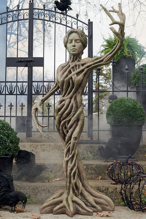 This haunting life-sized figure has a gnarled body made of tree roots, tree branch arms, and a creepy woman's head with closed eyes that you pray never open. Chicken Wire Ghost, Haunted Tree, Halloween Ghost Decorations, Tree Statues, Haunted Forest, Tree Root, Creepy Halloween Decorations, Life Size Statues, Lawn Art