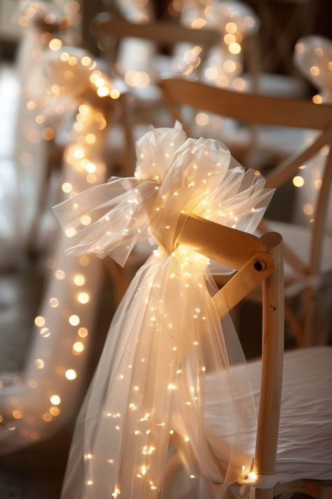 Transform your wedding into a fairytale with these stunning chair decorations. Tulle sashes and fairy lights add an ethereal touch to your reception. ✨🎀💡 Easy DIY setup for a night of wonder. #WeddingInspiration #FairyLights #DIYWedding #WeddingDecor #TulleDecorations #MagicalEvening #BridalStyle #WeddingChairDecor Let the romance sparkle! Wedding Dance Party Aesthetic, Fairy Light Wedding Reception, Tulle And Fairy Lights, Fairy Lights Wedding Reception, Fairy Light Wedding, Wedding Fairy Lights, Twinkle Lights Wedding, Bridal Shower Dinner, Brides Chair