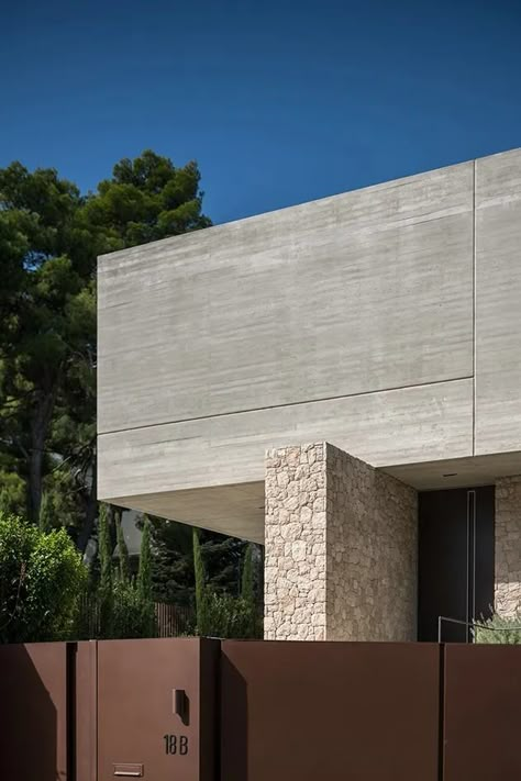 Tour this Residence in Dionysos in Greece | Wallpaper Concrete Elevation, Stone And Concrete Architecture, Architectural Concrete Wallpaper Beige Gold Room, Pigmented Concrete Architecture, Exposed Concrete Facade, Contemporary Elevation, Greece Wallpaper, Housing Architecture, 2023 Picture