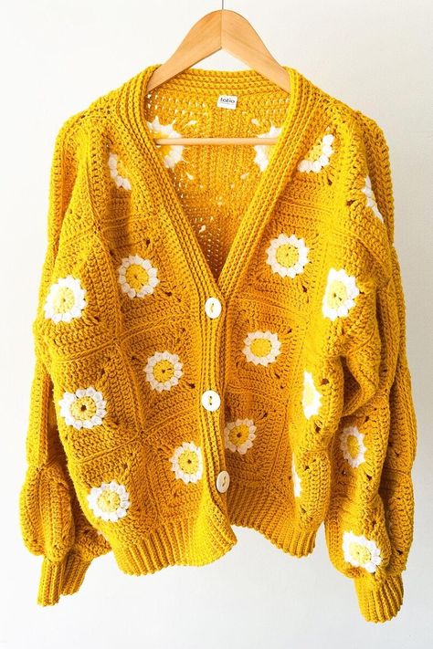 Front view of a mustard yellow crochet cardigan with granny squares and daisy patterns, featuring a cozy boho chic style. Yellow Granny Square, Crochet Sweater Pattern Easy, Granny Square Crochet Cardigan, Crochet Sweater Design, Woolen Sweaters, Square Crochet, Crochet Jacket, Granny Squares Pattern, Crochet Cardigan Pattern