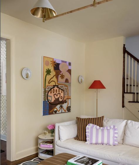 A butter yellow-drenched living room painted in Farrow’s Cream by Farrow & Ball. Cream Walls Interior Design, Creamy Yellow Walls, Yellow Cream Walls Living Room, Apricot Walls Living Room, Cream Walls Interior, Pale Yellow Walls Living Room Decor, Farrow Ball Yellow Ground, Farrows Cream Farrow And Ball, Yellow Walls Room Decor