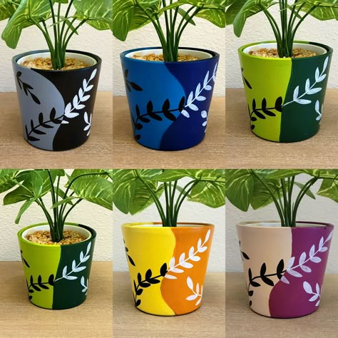 Place these along pathways or in flower beds to illuminate your garden at night. Planter Painting, Yin And Yang Symbol, Terra Cotta Pot Crafts Diy, Hand Painted Planter, Candle Pot, Plant Pot Design, Flower Pot Art, Vase Painting, Pot Decoration