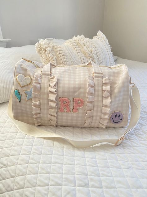 "These personalized duffel bags are perfect for overnight trips and long weekends. Thanks for taking a peek at my shop, I hope you find something you like!  ☆☆BAG DETAILS☆☆ *Choice of beige, pink, purple, blue or mint *Checkered pattern with ruffle detail *Measures approximately 17.5\" x 10\" x 7.5\" *Gold color zipper closure *Made of cotton and polyester Option to add patches A-Z in white, purple, light pink, hot pink, mint, or blue and fun specialty patches! *Up to 2 patches will fit in one l Duffle Bags Aesthetic, Aesthetic Duffel Bag, Aesthetic Duffle Bags, Cute Duffle Bag Aesthetic, Personalized Duffle Bag, Gift Bag Ideas For Women, Cute Duffel Bags, Duffle Bag Aesthetic, Cute Duffle Bag