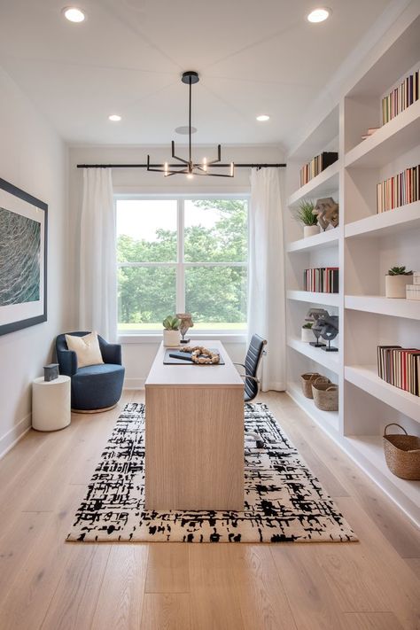 Bright and open home office with built-in shelving used for storage or as a bookshelf. Home Library Office, Home Office Layout, Library Office, Cozy Home Office, Small Home Offices, Office Layout, Home Office Setup, Home Office Space, Home Office Organization