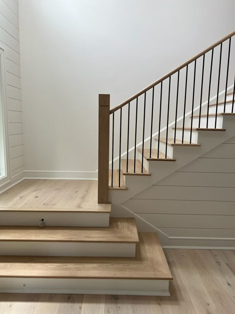 Another finished project! We love how this white oak and painted wood staircase turned out! This contemporary staircase is a gorgeous addition to this home. It uses a mixture of white oak, painted wood and iron stair parts. It also features a custom square wooden newel post with a decorative groove added. Interested in a similar style staircase for your home? Follow the link below to learn what stair parts were used. Stairs Painted White, Wood Stair Treads, Oak Handrail, Stair Posts, White Staircase, Painted Staircases, Wood Handrail, Contemporary Staircase, Staircase Handrail