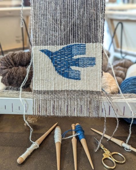 Demoing tapestry in the @jbfletcherstore museum today for the Columbia Basin culture tour! This piece is inspired by Swedish folk art. Handspun warp and weft, blue is indigo I dyed. . . . . #tapestry #tapestryweaving #wovenwallhanging #woventapestry #fibreart #fibreartist #weaving #handwoven #handweaving #weaversofinstagram #textileart #handwoventapestry #handspun #handspinning #handspunyarn #handmadeyarn #yarnlovers #yarnaddict #yarnobsessed #yarn #spinning #handmadehome #modernmaker #heri... Hand Woven Tapestry, Weaving Rugs On A Loom, Lap Loom Weaving Projects, Weaving Tapestry Patterns, Weaving Wall Art, Beginner Weaving Projects, Tapestry Weaving Patterns, Burlap Weaving, Finishing Weaving