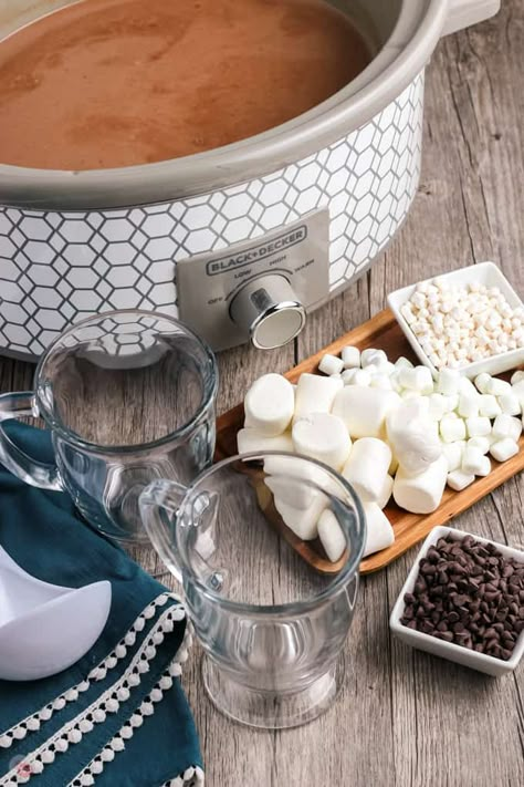 Crockpot Hot Chocolate is RICH, CREAMY, and DECADENT. With JUST 5 INGREDIENTS, it's perfect for serving up a thirsty crowd on a chilly night. Add a platter of your favorite toppings for a fun and festive hot cocoa bar! #hotchocolate #crockpotrecipe Crockpot Cover Diy, Hot Chocolate For A Crowd Easy, Crockpot Hot Cocoa For A Crowd, Hot Cocoa For A Crowd, Crockpot Cocoa, Hot Chocolate For A Crowd, Crockpot Hot Cocoa, Easy Hot Cocoa Recipe, Crockpot Hot Chocolate