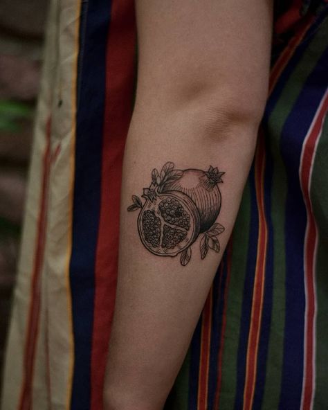 Small palm sized pomegranate etching fineline tattoos blackwork tattoo of pomegranate fruit vintage illustration on arm tattoo by Alexandyr Valentine Tantalus Tattoo, Realism Fruit Tattoo, Vintage Pomegranate Illustration, Orange Fruit Tattoo Black And White, Persephone Tattoo Minimalist, Pomegranate Tattoo Meaning, Persephone Inspired Tattoo, Tattoos Inspired By Movies, Pomegranate Tattoo Black And White