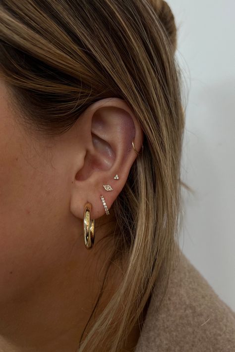 Have fun creating an ear stack you'll love. From solid gold hoops, diamond huggies and studs these earrings are designed to wear daily. Small Ear Stack, Simple Ear Stack, Eating Stack, Earring Stacks, Minimalist Ear Piercings, Earring Stack, Ear Art, Cool Ear Piercings, Pretty Ear Piercings