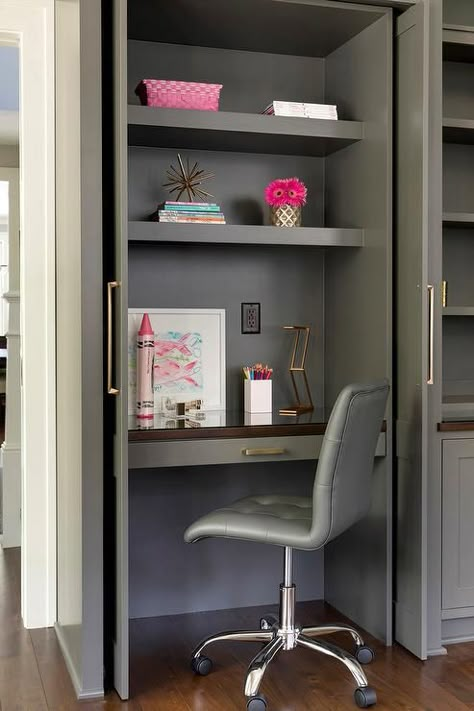 A small gray closet with folding doors open to a built-in desk with upper shelves and a gray swivel leather chair. Desk In Closet, Inside Wardrobe, White Floating Desk, Built In Desk And Shelves, Gray Closet, Hidden Desk, Closet Desk, Desk Nook, Home Office Closet