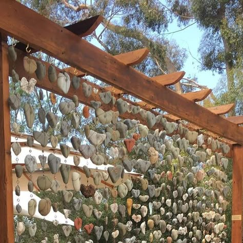 Happy Gardens 😀 on Instagram: "“My heart rock wall ❤️ with copper wire, no drilling.” . 📸: Lynette La Mere" Heart Rock Garden Ideas, Rock Hanging Decor, Heart Rock Display Ideas, Heart Rock Garden, Outdoor Rock Collection, Heart Shaped Rocks Display, Heart Rocks Display Ideas, How To Display Rocks, Displaying Rocks