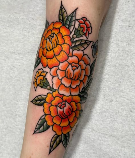 Marigold Memorial Tattoo, Neo Traditional Marigold Tattoo, Marigold Hand Tattoo, Carnation Flower Tattoo Traditional, American Traditional Marigold Tattoo, Merigold Aesthetic Flower Tattoo, Marigold Tattoo Traditional, Marigold Tattoo Color, Marigold Traditional Tattoo