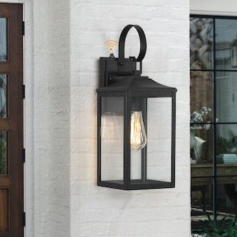 True Fine Norwich 1-Light 18-in H Black Dusk to Dawn LED Outdoor Wall Light in the Outdoor Wall Lights department at Lowes.com Exterior Light Fixture Over Front Door, Black Farmhouse Outdoor Light Fixtures, Outdoor Light Fixtures Garages, Black Outside Lights, Outdoor Wall Lights On House Garage, Door Lights Exterior, Outside Lights Front Door, Coach Lights Exterior, Garage Door Lights Exterior