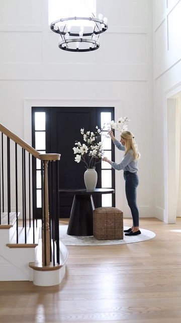 Interior Design | Real Estate on Instagram: "I love a round table in the middle of a foyer … see more of our home on my personal page @katerumson Round table: @sherrillfurniturebrands Faux magnolia branches: @elevengardens #SherrillPartner #newhome #foyerdesign #twostoryfoyer #newbuild #newconstruction #newjersey" Table In Middle Of Entryway, Foyer With Table In Middle, Table In Foyer Entry Ways, Foyer Center Table, Circle Table Entryway, Round Rug Entryway Front Entry, Foyer Table Round, Entryway Table Round, Entryway With Round Table