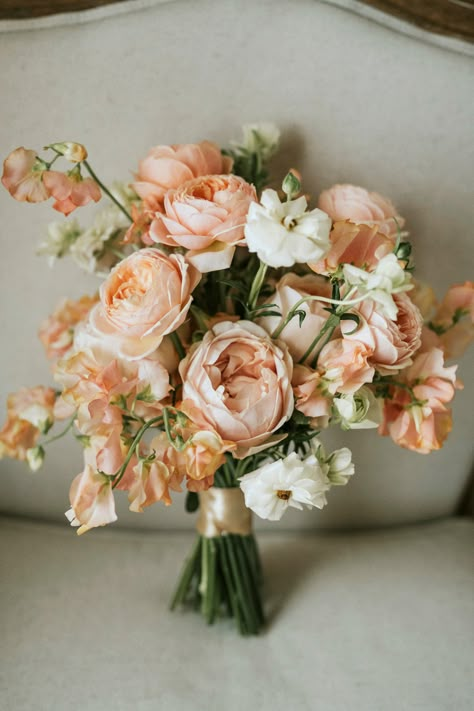 A bouquet adorned with delicate peachy and pink hues, embodying the essence of romance and love's beauty. 💐💖 Each petal tells a story of elegance and grace. #RomanticBouquet #PeachyPinkTouches #WeddingFloralArtistry #Flowers #Bridesbouquet #Love #Makehappymemories #destinationwedding Peach And Pink Bridal Bouquet, Peachy Pink Wedding Bouquet, Champagne And Peach Bouquet, Peach Peony Wedding Bouquet, Light Peach Ivory Wedding, Beach Wedding Peach Colors, Wedding Flowers With Peonies, Peony Flower Bouquet Floral Arrangements, Peach Bride Bouquet