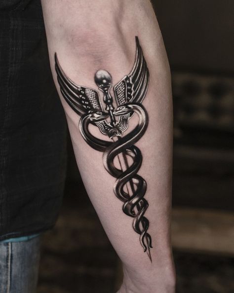 The caduceus, featuring two snakes wrapped around a staff, is an ancient and powerful symbol used in mythology and medicine. Getting a caduceus tattoo... Hermes Caduceus Tattoo, Doctor Symbol Tattoo, Hermes Symbol Tattoo, Staff Of Caduceus Tattoo, Medical Snake Tattoo, Staff Of Hermes Tattoo, Medical Staff Tattoo, Hermes Staff Tattoo, Emergency Medicine Tattoo