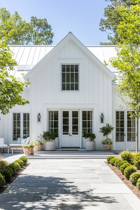 Cozy Coastal Farmhouse Exterior, White Board and Batten Siding, Metal Roof Design, Farmhouse Curb Appeal, Modern Farmhouse Style, Front Porch Inspiration, Symmetrical Home Design, Rustic Outdoor Decor, Light and Airy Exterior, Coastal Cottage Home, Elegant Farmhouse Entrance, Slate Walkway, Natural Landscaping Ideas, White Farmhouse Exterior, Classic Home Architecture Metal Roof Board And Batten Siding, Farmhouse Coastal Exterior, Modern Farmhouse With Detached Garage, Exterior House Board And Batten, Exterior Addition Ideas, White Siding White Windows, White Metal Roof House, White Farmhouse White Windows, White House With Metal Roof