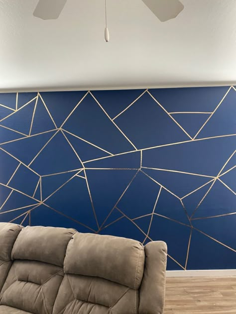 Blue and gold accent wall. Blue/Gold. Blue. Gold Trim. I didn’t think it was possible for me to do it but i did it!!!! Navy Wall With Gold Accents, Navy Blue Wall With Gold Stencil, Navy Blue Bedroom Walls Gold Accents, Teal And Gold Accent Wall, Accent Wall With Gold Trim, Bedroom With Blue And Gold Accents, Blue Gold Room Decor, Navy And Gold Accent Wall, Navy Blue And Gold Accent Wall