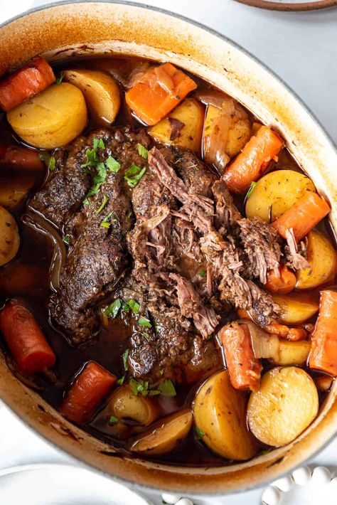 Nothing says comfort food more than our Sunday best Dutch Oven Pot Roast recipe. Mouthwatering bites of roast beef is braised in its rich juices until tender with earthy carrots, caramelized onions, and Yukon gold potatoes. This simple recipe is a timeless classic that is perfect for entertaining company or establishing a weekend tradition for your family. #potroast #yankee #Sunday #dutchoven #best #easy #slowcooker #dinner #chuckroast #beef #beefroast Pot Roast Vegetables, Roast Oven, Balsamic Pot Roast, Dutch Oven Pot Roast, Roast Slow Cooker, Oven Pot Roast, Perfect Pot Roast, Classic Pot Roast, Roast Beef Sandwich