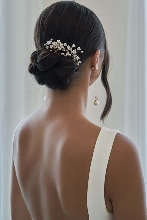 Low Bun Wedding Hair With Comb, Low Bun Hair Piece, Hair Pin Wedding Hairstyles, Bride Hair With Hair Piece, Bride Hair Elegant, Bridal Hair Design, Bridal Hair Bun With Hair Piece, Wedding Updo With Pearl Pins, Sophisticated Bun Hairstyles