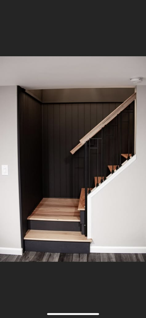 Moody Basement Stairs, Basement Steps With Landing, Black Basement Stairwell, Concrete Basement Makeover, Basement Bar Remodel Before And After, Staircase Design Basement, Black House Ideas Interior, Basement Stair Renovation, Basement Stairwell Paint Ideas