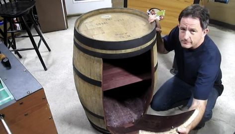 Looking for a unique upcycle project? Here's a tutorial to help you build the perfect DIY wine barrel cabinet of your dreams! Check out more upcycle projects at Hometalk! Wine Barrel Cabinet, Wine Barrel Furniture Diy, Diy Whiskey Barrel Bar, Whiskey Barrel Liquor Cabinet Diy, Half Whisky Barrel Ideas, Barrel Trash Can Ideas, Repurposed Whiskey Barrel, Old Wooden Barrel Ideas, Diy Wine Barrel Bar