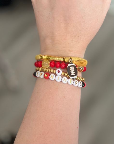 These Custom San Francisco 49ers  stackable bracelet with charms are perfect for adding  personalized jewelry for game day or just to show supper for Forty-Niners Fans. Each bracelet is unique and one-of-a-kind. with TONS of options from 49ers heishi bracelet to stackable beaded bracelets.  Our personalized beaded bracelets are fully customizable, allowing you to choose the beads, colors, and charms that resonate with your personality and preferences.  These stackable bracelets make  great gifts for 49ers They are also a wonderful way to treat yourself and add a personal touch to show off on your 49ers gameday bracelet! 49ers Bracelet Ideas, 49ers Bracelet, Slay Bracelets, 49ers Gifts, Sf Niners, 49ers Super Bowl, Stackable Beaded Bracelets, New Apple Watch Bands, Forty Niners