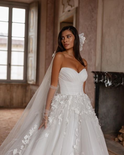 The «Valentino» gown is elegance in every detail. The draped corset perfectly accentuates the silhouette, adding sophistication, while the delicate 3D embellishments on the skirt create a sense of lightness and charm. 
This dress is the perfect choice for a bride dreaming of a unique look on her special day🤍

Сукня «Валентіно» — це вишуканість у кожній деталі. Драпірований корсет ідеально підкреслює силует, додаючи образу елегантності, а ніжне 3D-оздоблення на спідниці створює легкість і чарі... Wedding Dress With Long Train, Dress With Long Train, Dramatic Silhouette, Shoulder Wedding Dress, Floral Decorations, Breathtaking Wedding, Ivory Wedding Dress, Walk Down The Aisle, Long Train