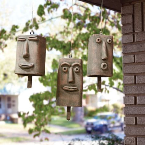 Hanging bells with personality. Handcrafted from clay, each wears its own expression: blissfully happy, sort of surprised, and really surprised. Each suspends from a length of twine. About 3" wide, 6½" to 8" high. Set of 3. Beginner Pottery, Ceramic Bell, Clay Face, Kids Pottery, Hanging Bell, Pottery Handbuilding, Clay Faces, Garden Pottery, Hand Built Pottery