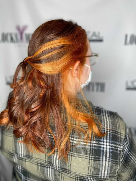 Copper orange underneath and money pieces with red-brown toned hair Courtesy of Stasia at Locks Myth Salon in Jacksonville, FL Two Toned Copper Hair, Orange Peak A Boo Hair, Ginger Hair With Underneath Color, Copper Hair Underneath, Copper Hair Underneath Brown, Orange On Brown Hair, Dark Brown Hair Orange Highlights, Brown Hair With Ginger Underneath, Brown Hair Ginger Underneath