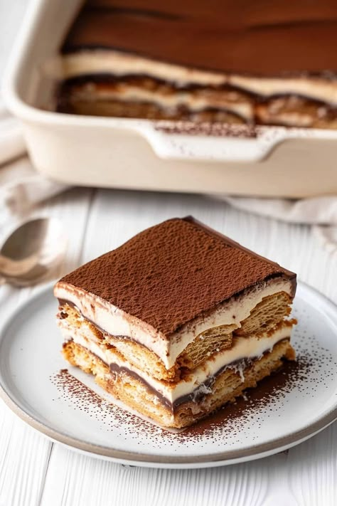 This decadent chocolate tiramisu features cocoa-coffee-soaked ladyfingers layered with silky mascarpone cream and rich chocolate ganache. It's an impressive, irresistible dessert. Gansito Cake, Classic Tiramisu Recipe, Best Tiramisu Recipe, Best Tiramisu, Tiramisu Recept, Easy Tiramisu, Classic Tiramisu, Easy Tiramisu Recipe, Tiramisu Cake