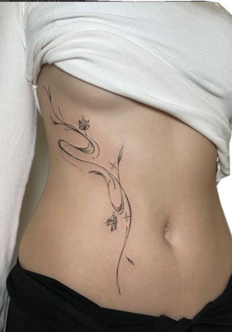 Korean Fine Line Tattoo, Whispy Tattoo, Vietnamese Tattoos For Women, Side Of Body Tattoos For Women, Whispy Tattoos, Flower Tattoo Stomach, Stomach Tattoos Ideas, Lower Spine Tattoos For Women, Flower Stomach Tattoos