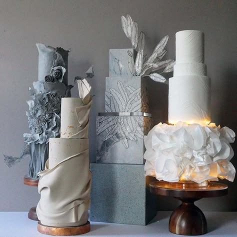 Enrique Rojas - Contemporary Wedding Cake Design on Instagram: ". . NEUTRALITY . Which one is your favourite? From Left to Right? . I know photos aren’t relevant this side of the Pond anymore but I love Photos! . . . . . Made with @saracinodolci Pasta Top + Wafer Paper Embosser+ Stencil by @cakesbyangelamorrison | Use ENRIQUE10 For 10% off Molds by @moleeks_cakehouse | Use ENRIQUE55 for 10% off . #cakereel #stencilart #cakedecorating #cakesofinstagram #stencil #reels #reel #cakesofinsta #tallca Ruffle Cake Tutorial, Concrete Wedding Cake, Contemporary Wedding Cake, Square Cake Design, Wedding Cake Designs Simple, Contemporary Wedding Cakes, Cake Display Table, Wedding Cake Design, Cake Wraps