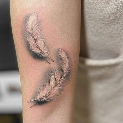 Feather Tattoos On Wrist, Feather Dragonfly Tattoo, Feather Wrap Around Tattoo, Elegant Feather Tattoo, Two Feather Tattoo Design, 3d Feather Tattoo, Realism Feather Tattoo, Floating Feather Tattoo, White Feather Tattoos For Women