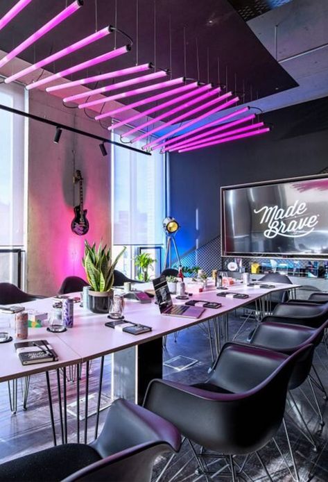 We created an adaptable system for the interiors, helping the space to react and reconfigure as the business continues to shift and grow. We specified sustainable materials with an industrious feel, with furnishings, digital installations and lighting that would make the space distinctively, ‘Brave’. #pink #neon #interior #design #architecture #creativeagency #sandco Futuristic Office Interior, Neon Interior Design, Old Farmhouse Aesthetic, Cyberpunk Interior Design, Valentines Table Decor, Futuristic Office, Room Ideas For Men, Cozy Room Ideas, Room Ideas For Men Bedroom