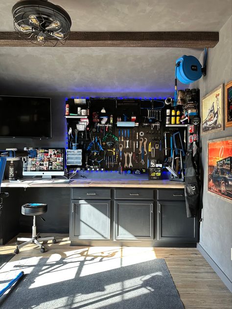 Built my husband a man cave/bike shop and now he’s always in here working! The faux beams came from @ekenamillwork and for the tool wall i used @wallcontrol. #bikeshop #mancave #mancaveideas #fauxromanclay #romanclay #walltexture #workshop #toolorganization #toolwall #wallcontrol Bike Tool Storage, Diy Man Cave, Officine In Garage, Roman Clay, Small Man Cave, Cave Design, Outdoor Shower Diy, Man Cave Shed, Tool Wall