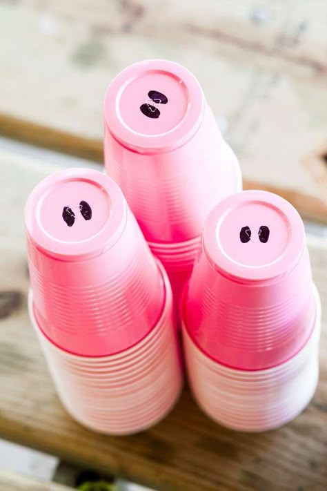 Take a cool at this simple idea that is so cool for a Farm 1st Birthday Party! Paint 2 nostrils on the bottom of pink plastic cupcakes and you've yourself a bunch of pig snout cups!! See more party ideas and share yours at CatchMyParty.com #catchmyparty #farmbirthdayparty #pigcups #funpartyideas #pigs #farmanimals Farm 1st Birthday Party, Pig Birthday Party Decorations, Farm 1st Birthday, Farm Birthday Party Ideas, Girls Farm Birthday, Peppa Pig Birthday Party Decorations, 4de Verjaardag, Peppa Party, Cow Birthday Parties