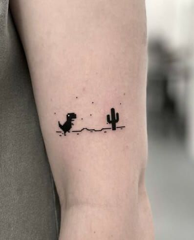 Cactus With Dinosaurs Simple Tattoo Dinasour Tattoo Tiny, Henna Dinosaur, Matching Gaming Tattoos, Small Gaming Tattoo, Simple Dino Tattoo, Simple Guy Tattoos, Dino Tattoo Ideas, Silly Small Tattoos, Simple Cool Tattoos