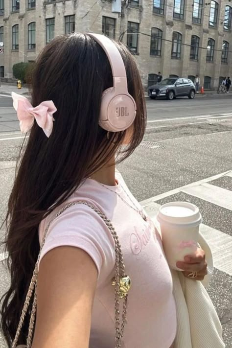 Long, Layered Chestnut Locks Enhanced by a Soft Pink Bow Accessory, Offering a Playful Twist to a Sophisticated Look // Photo Credit: Instagram @silkycoquette Pink Headphones, Wearing Headphones, Pink Lifestyle, Pretty Pink Princess, Coquette Girl, Princess Core, Pink Aura, Pink Life, Pink Pilates Princess