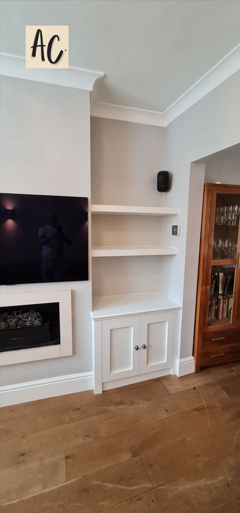 White simple elegant cabinets and floating shelves. Inset Shelves In Wall Living Room, Cove Shelving, Inset Shelves In Wall, Cabinets And Floating Shelves, Bedroom Alcove, Alcove Units, Alcove Cabinets, Alcove Storage, Alcove Cupboards