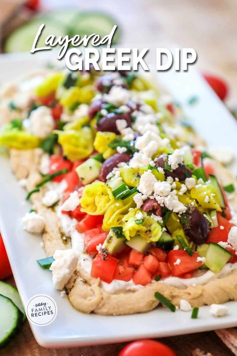 This is THE BEST DIP RECIPE EVER! This easy layered greek dip is quick to make, requires no cooking, and people rave about it every time it is served. It is kind of like a seven layer greek dip where all of the ingredients are layered on top of each other to form a fresh, healthy party dip perfect for an appetizer or neighborhood BBQ. Serve this easy greek layer dip with fresh pita or chips. Layered Mediterranean Dip, 7 Layer Hummus Dip, Greek Dip 7 Layer, Mediterranean Layer Dip, Greek Salad Dip, Loaded Hummus Dip, Greek Appetizers Parties Food, Greek Finger Food, Greek Appetizers Easy