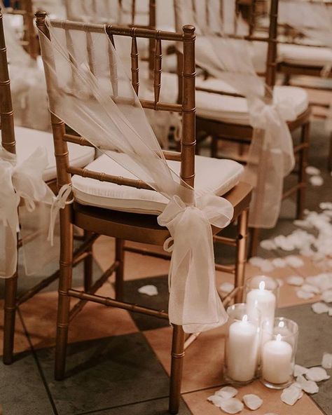 How gorgeous is this aisle decor!!??  #weddingflowers  #weddinginspiration  #aisledecor #weddingceremonydecor #romanticwedding Ideas For Chairs At Wedding, Extra Wedding Decorations, Wooden Chair Wedding Decor, Aisle Chairs Wedding, Elegant Wedding Chairs, Chivari Chair Sash Ideas, Tulle Wedding Chair Decorations, Wedding Chair Covers And Sashes, Tiffany Chair Decoration