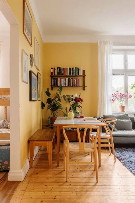 Yellow Wall Apartment, Yellow Front Room, Yellow Floor Living Room, Living Room Wall Color Yellow, Butter Yellow Living Room, Yellow Playroom Walls, Dining Room Decor Colorful, Yellow Apartment Aesthetic, Living Room With Breakfast Nook