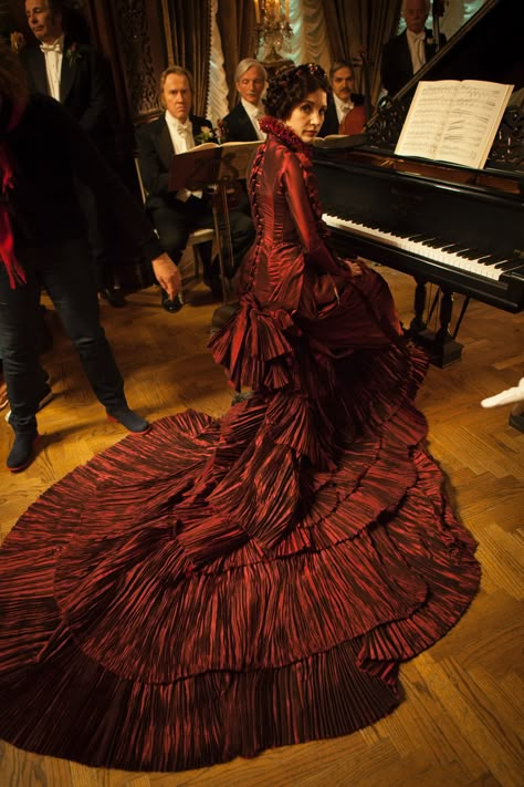 In Crimson Peak, the red dress (shown desaturated in this picture) instantly establishes Lady Lucille as being different from the pastel-clad partygoers (including Edith) and associates her with blood. Crimson Peak Costumes, Lucille Sharpe, Film Costumes, Mia Wasikowska, Crimson Peak, Gothic Romance, Ciel Phantomhive, Costume Drama, Wolfram