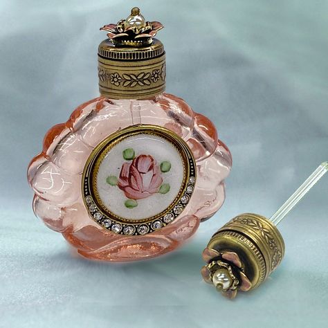 Decant a favorite scent or essential oil into this vintage perfume bottle to carry with you or display on your vanity.In translucent pink glass, the scalloped shape is pressed from the original 70 year old molds. The metal work features a vintage circa 1940s cloisonne rose enamel disk encircled by a graduated border of premium crystal. The top is mounted with a dimensional vintage metal rose, centered with a pearl. Glass dauber stem is attached inside the top for application of fragrance. Finish Mini Perfume, Rose Essential Oil, Essential Oil Bottles, Scent Bottle, Rose Vintage, Vintage Perfume Bottles, Glass Candy, Cloisonne Enamel, Bridal Bracelet