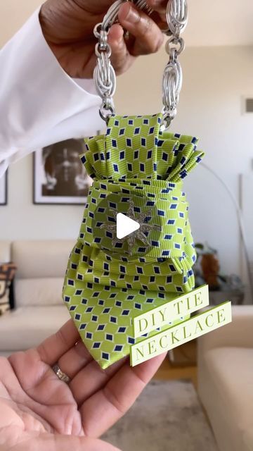 BRENDA  | Content Creator on Instagram: "DIY - Tie Necklace 👔 

I love an easy DIY almost as much as I love accessories ✨ 

This styling tip from @bengelaholmes has both!  All you need is a men’s tie, folded and secured with a rubber band and safety pin🧷. Then take a chain or ribbon to slip through the top and secure around the neck. 

If you don’t have a tie handy, you can get them at the thrift store for less than $5 ( I have mine dry cleaned). The brooch is optional but I think it adds a nice touch, and in this case a bit of bling 💎 

The entire thing takes 5 minutes to complete and the look is super chic. 

@bengelaholmes has a detailed tutorial on her page for this and many other styling hacks. Be sure to check her out and tell her I sent you!! 💚 💚 💚 

What do you think about th Neck Tie Upcycle, Neck Tie Necklace Diy, Woman Tie Outfit, Tie Patterns Diy, Tie Women Outfit, How To Tie A Belt, Neck Tie Projects, Diy Necktie Projects, Mens Ties Crafts