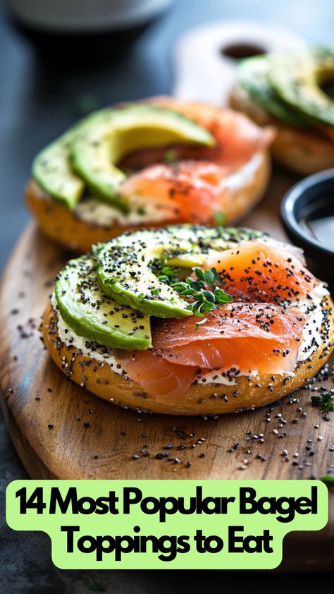 A toasted bagel topped with cream cheese, smoked salmon, avocado slices, and a sprinkle of herbs on a wooden board. Sandwich Bagel Ideas, Mini Lox Bagels, Yummy Bagel Ideas, Bagel Cream Cheese Toppings, Dairy Free Bagel Toppings, Open Face Bagel, Bagel Buffet Brunch, Bagels With Salmon And Cream Cheese, Build Your Own Bagel Bar